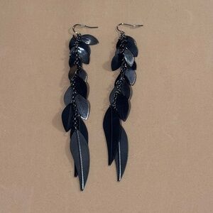 Black leaves drop long earrings.